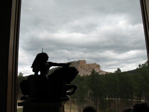 The Crazy Horse Memorial – mini-scale statue in the foreground, actual in the background.